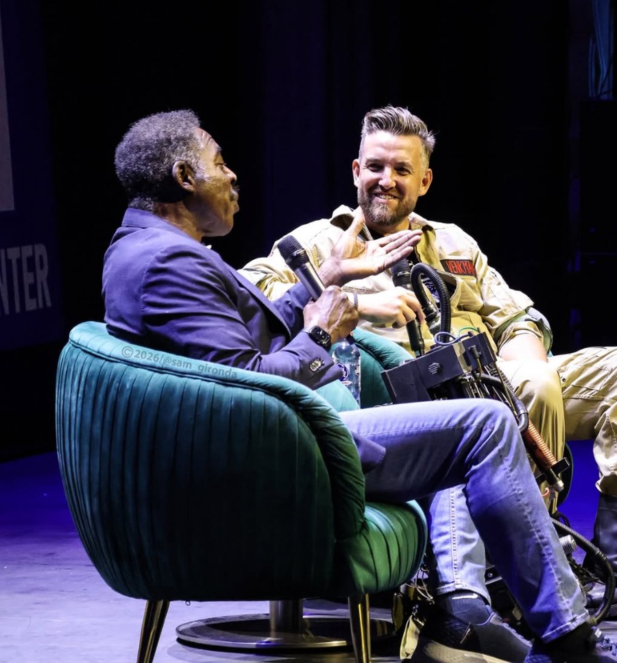 Ryan Adams on stage interviewing Ernie Hudson